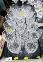 Fourteen cut glass wine glasses, differing designs.