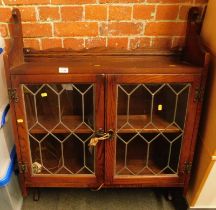 An Old Charm oak wall cabinet, with two leaded glazed doors, enclosing a shelf, 113cm high, 90cm wid