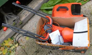 A Flymo Rollermo electric lawn mower.