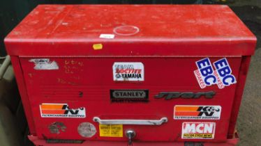 A Stanley Sport red metal tool chest, 34cm high, 67cm wide, 30cm deep.