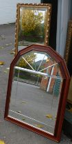 A rectangular wall mirror, with gilt coloured relief moulded edge, 124cm x 39cm, and an oak framed w