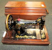 A cased Singer sewing machine.