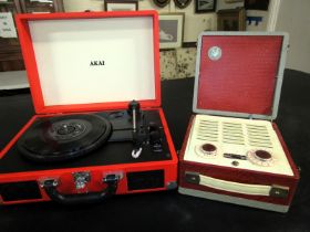 An Akai portable record player, in faux leather case, together with a Vidor radio.