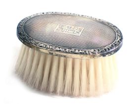 A miniature silver mounted dressing brush, stamped 17.9.72 Curtis, Birmingham 1971, in fitted case.