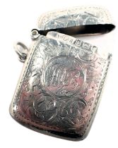 An Edwardian silver vesta case, engraved with scrolls and with initials to centre, Birmingham 1903,