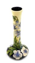 A Moorcroft ceramic bottle shaped vase, decorated with white and pink flowers, impressed marks to un