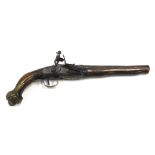 A 19thC flintlock pistol, the steel barrel embellished in brass with scroll work, indistinctly numbe