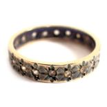 A 9ct gold eternity ring, of star set design, set with CZ stones, ring size N½, discoloured, 2.6g al