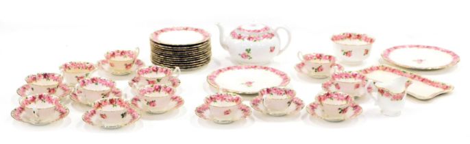 A Royal Doulton pink rose pattern part tea service, comprising teapot, two large plates, a rectangul