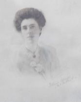 An Edwardian hand tinted photograph, indistinctly signed, in the form of a lady wearing a shawl with