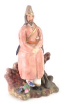 A Russian porcelain figure, of a gentleman in pink overcoat, with rifle, stamped FS, 16cm high. (AF)