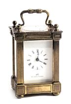 A modern Matthew Norman brass carriage clock, with column supports and original box, 12cm high.