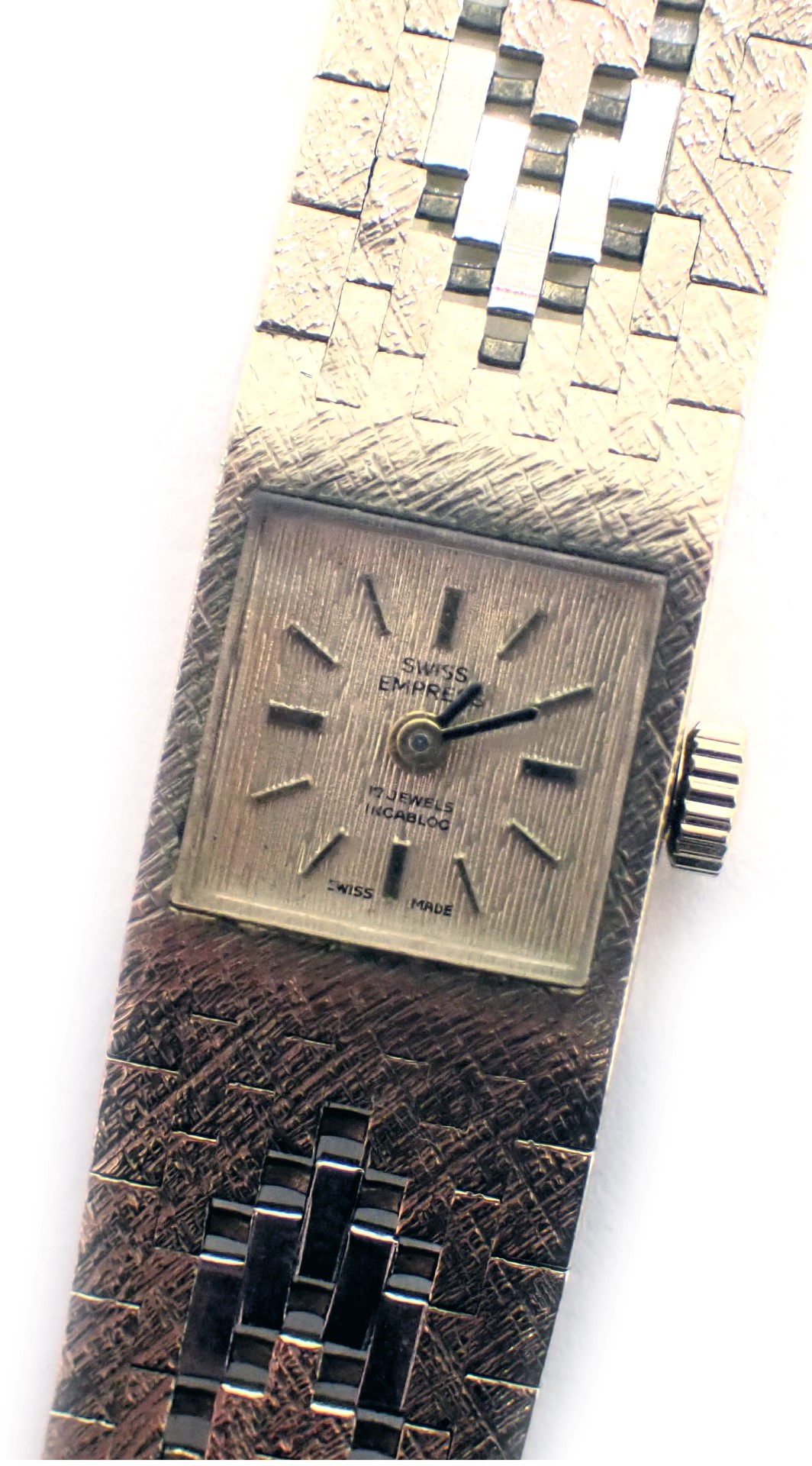 A Swiss Empire 9ct gold lady's wristwatch, the strap of bicolour design, with white, yellow and rose