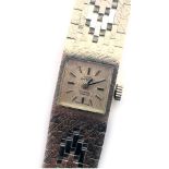 A Swiss Empire 9ct gold lady's wristwatch, the strap of bicolour design, with white, yellow and rose