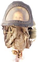 A World War II baby's gas mask, of shaped Perspex cover, with composite doll for demonstration, 43cm