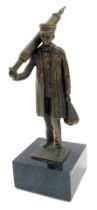 A bronze figure of a chimney sweep, on a black marble base, 32cm high.