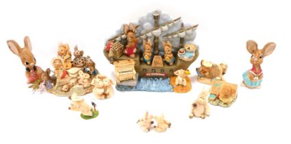 A group of Bunnykins, Pendelfin and Piggins figures, comprising Bunnykins boat, Pendelfin stand, and