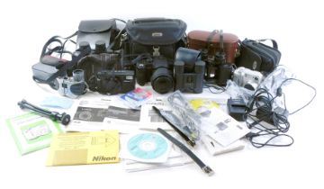 A quantity of Nikon and other cameras, to include an L35, a Panasonic DMC.FZ30 camera, etc., and two