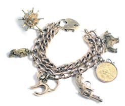 A 9ct gold two bar charm bracelet, with heart shaped padlock and assortment of charms, the bracelet