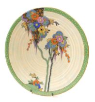 A Crown Devon Art Deco wall plaque or charger, decorated with flowers and leaves in brightly coloure