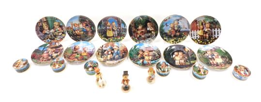 A quantity of Hummel designed items, to include collectors plates, boxes and covers, and three figur