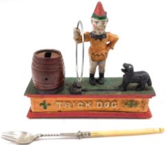 A cast iron Trickster money bank, and a pickle fork with bone handle. (2, AF)