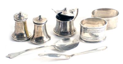 A collection of small serve ware, to include a mustard pot, pepper pot, salt pot, two napkin rings,