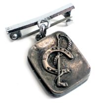 A silver horse related pendant/brooch, the small rectangular silver locket with horseshoe and riding