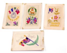 Four WWI silk postcards.