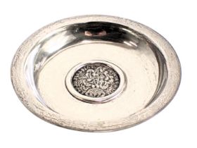 A Continental white metal pin tray, inset to the bottom with a coin bearing date 1756, 2.55oz, 10cm