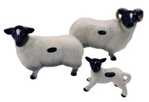 Three Coopercraft ceramic sheep, a ram, a sheep, and a lamb.