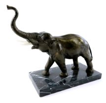 A 20thC elephant sculpture, bronzed resin finish, on a rectangular black marble base, with replaceme