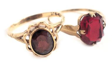 Two dress rings, comprising a garnet cluster ring with petalated border on V splayed shoulders, yell