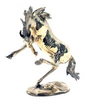 A brass model of a rearing horse, on oval foot, 32cm high.