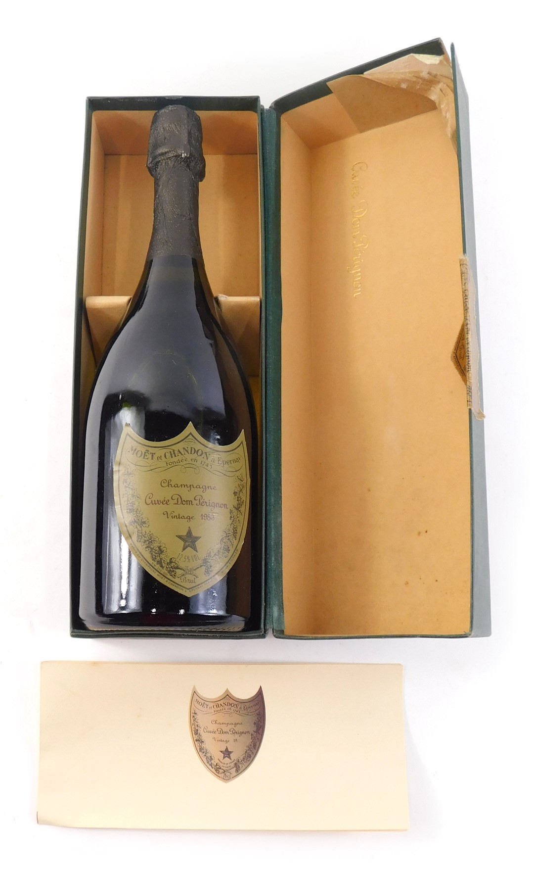 A bottle of Moet and Chandon Dom Perignon Vintage 1983 Champagne, in presentation box with paperwork