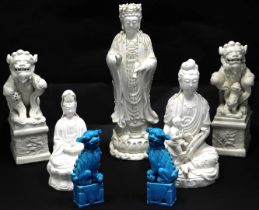 A group of Chinese figures, comprising a pair of blue glazed Dogs of Fo, 13cm high, three figures, 3