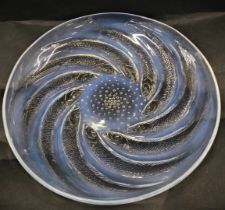 A Lalique poissons opalescent art glass shallow dish, crazed mark centre, 26cm diameter.