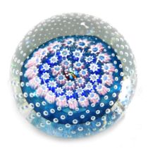 A John Deacon millefiori paperweight, with all over bubble decoration, in shades of pink and blue su