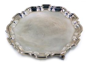 An Elizabeth II silver salver, with scroll cast feet, Sheffield 1959, 27oz.