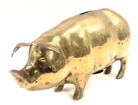 A brass pig money bank, 17cm high.