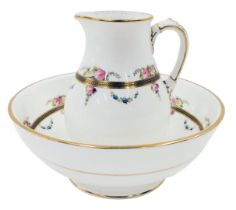 An early 20thC china wash jug and bowl set, elaborately decorated with roses and gilt borders, the j