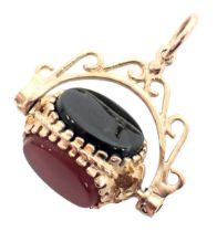 A swivel agate fob, the tricolour swivel set with bloodstone onyx and black onyx, in a yellow metal