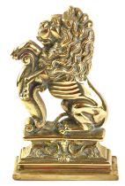A brass doorstop, formed as a roaring lion, 34cm high.
