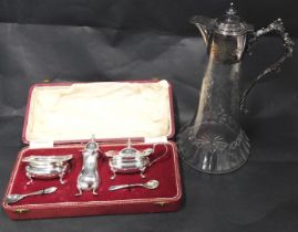 A late 19th/early 20thC cut glass and silver plated claret jug, 29cm high, and a silver plated cruet