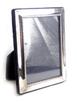 An Elizabeth II silver mounted photograph frame, of plain form, Sheffield 1995, 15cm high.