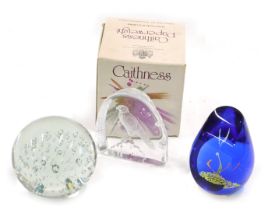 A Caithness phoenix limited edition paperweight, number 26762/1000, and two other paperweights.