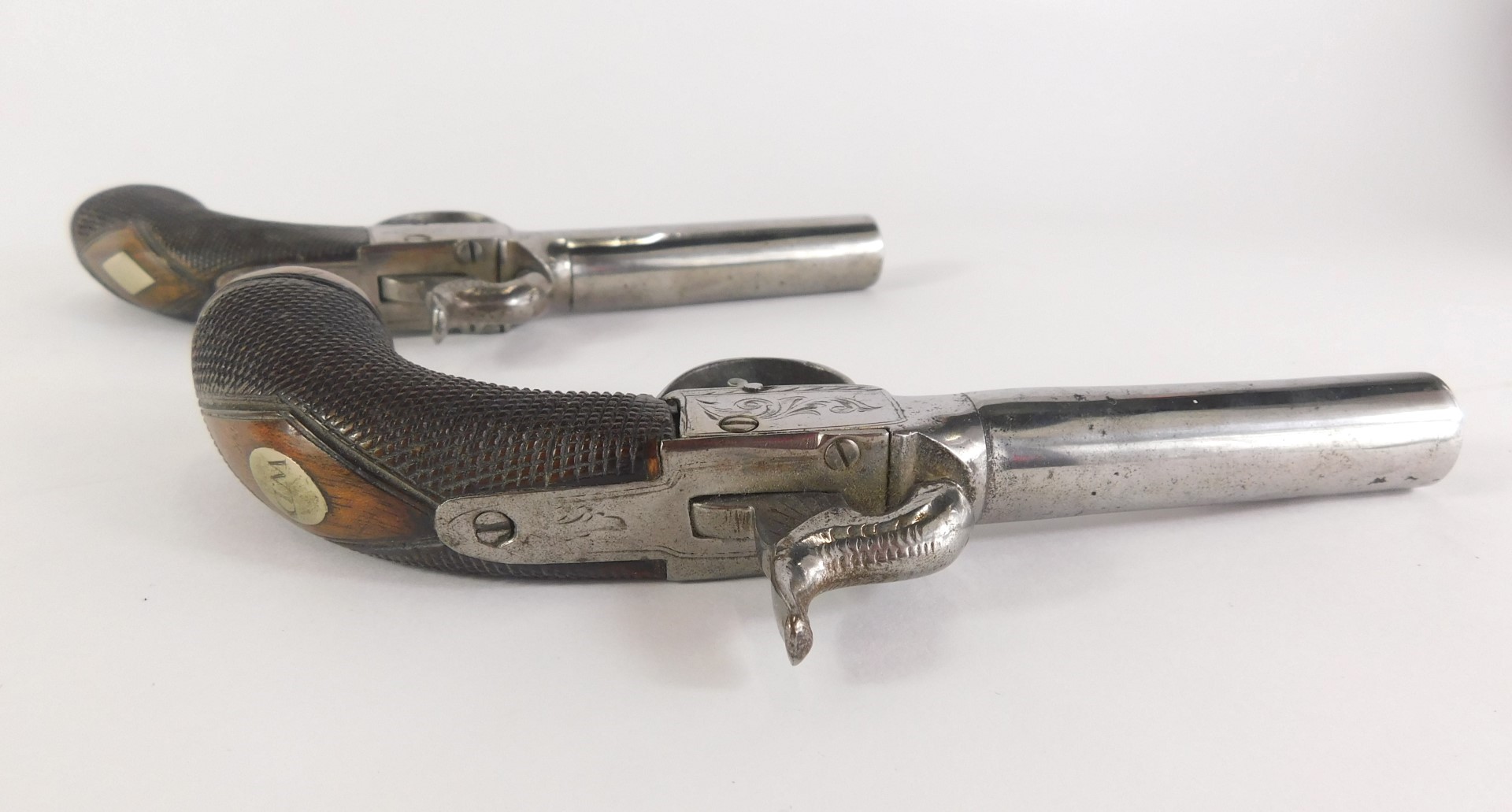A pair of early 19thC pistols, each with a polished barrel, partly engraved and walnut stock, 19cm l - Image 6 of 8