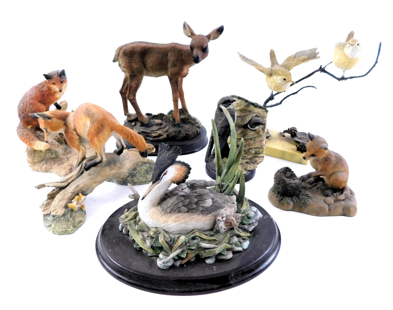 A collection of animal ornaments, comprising fox and cubs, Border Fine Arts fox on log, Border Fine