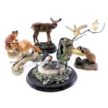 A collection of animal ornaments, comprising fox and cubs, Border Fine Arts fox on log, Border Fine