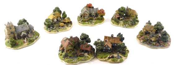 A quantity of Danbury Mint and other Lilliput Lane style cottages.